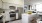 kitchen with stainless steel appliances and white cabinets and island